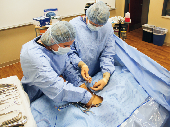 two females running surgical technology simulation