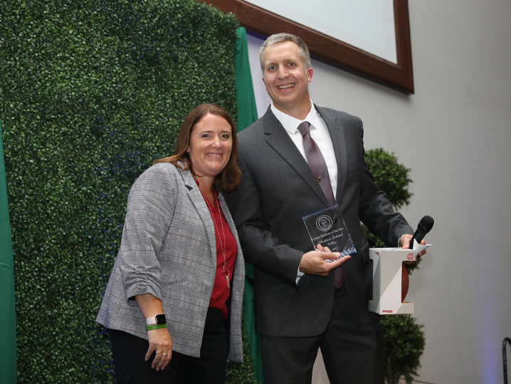 BTC District Board Member Rob Hendrickson accepting award on behalf of Blackhawk Technical College