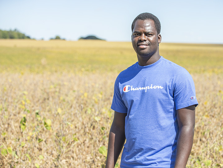 Student, Issa Conombo, pictured in green field outdoors