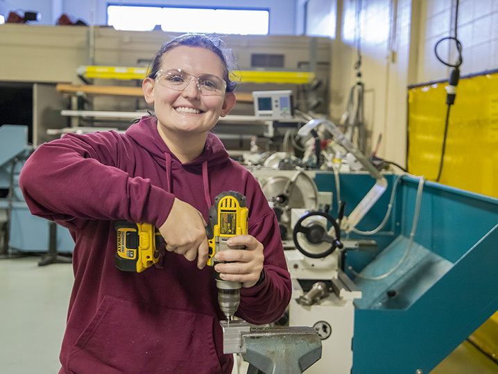 student Heather Goold pictured with a power drill