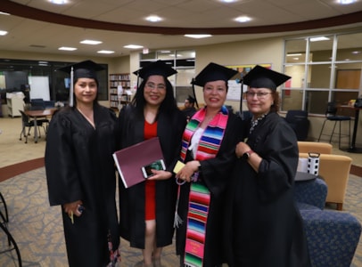 Students in cap and gown for GED graduation