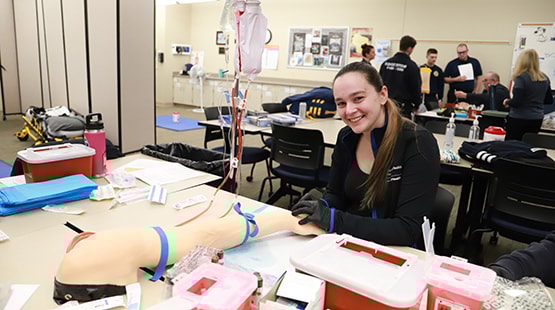 Paramedic student working in lab