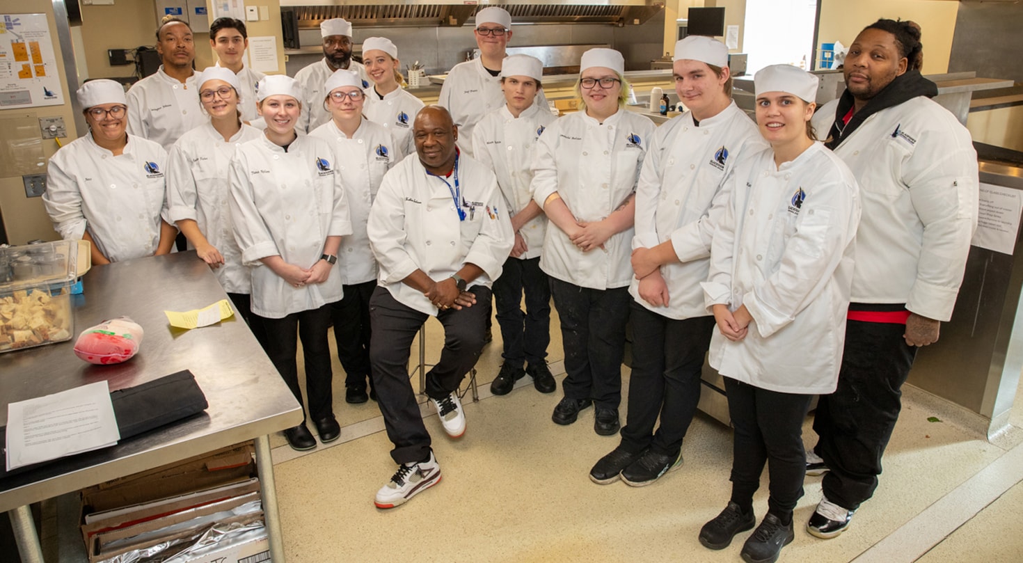 Group shot of Culinary Arts students in the kitchen