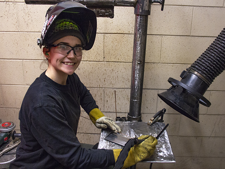 female welding student in lab