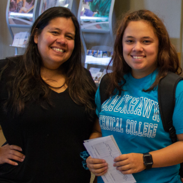 student and parent at campus registration event