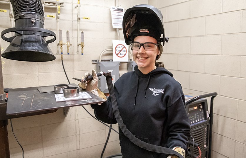 female welding student in lab